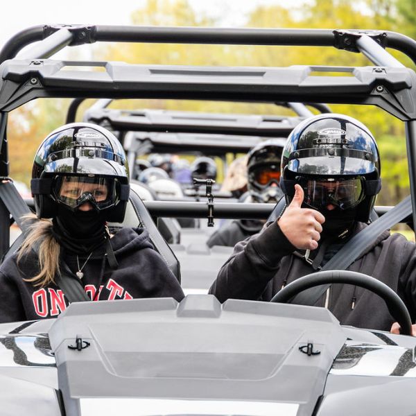a group of police officers riding on the back of a motorcycle mirror