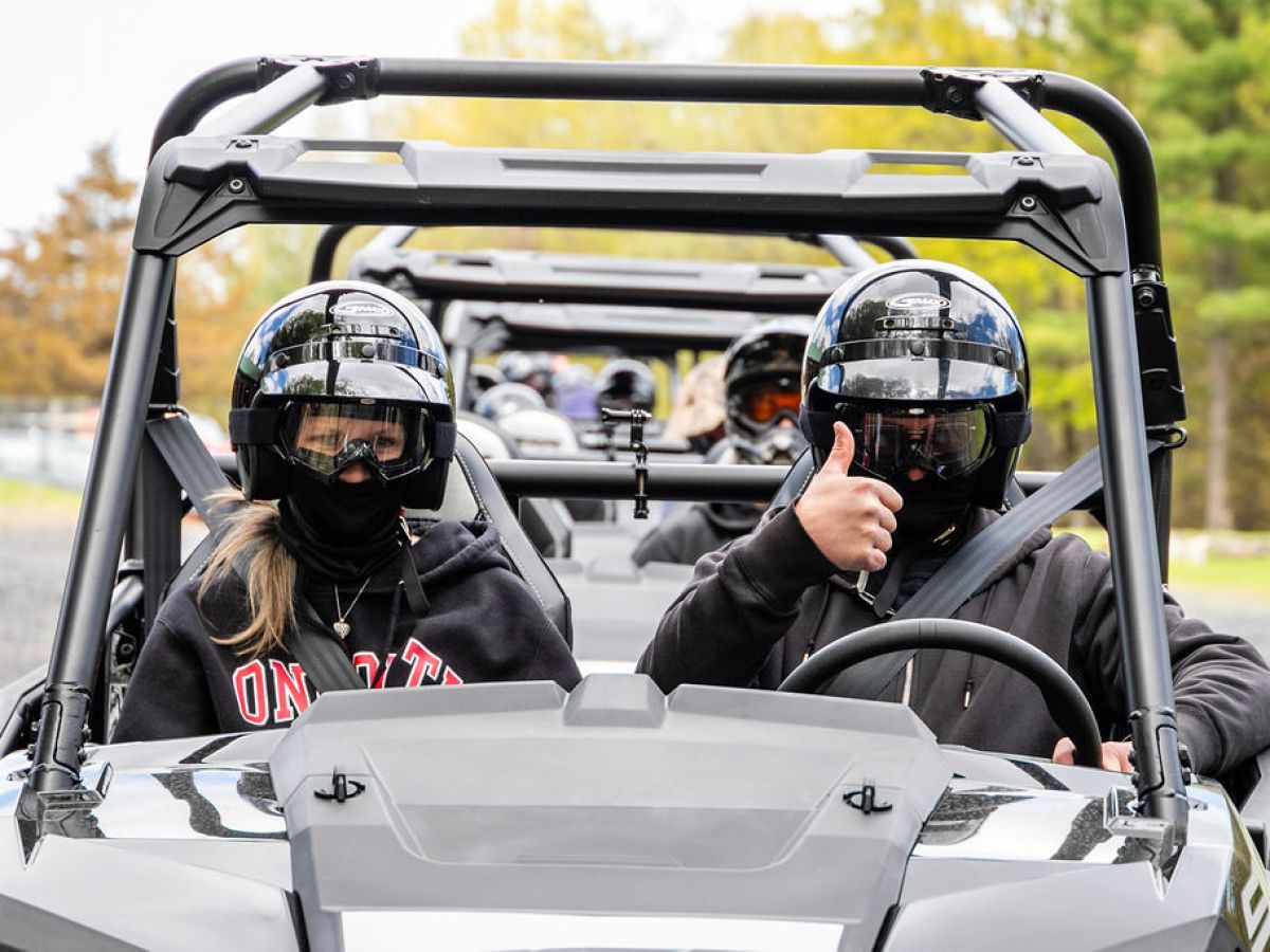 people driving a rzr