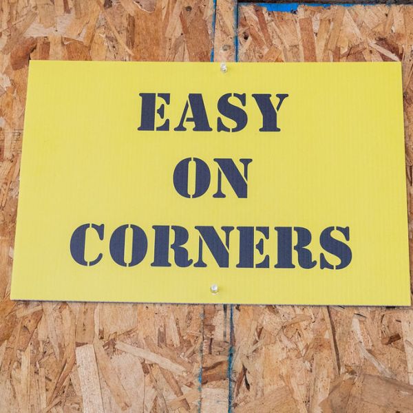 a sign in front of a brick building